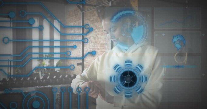 Woman tapping smartwatch by weight rack, summoning holographic HUD while checking fitness data