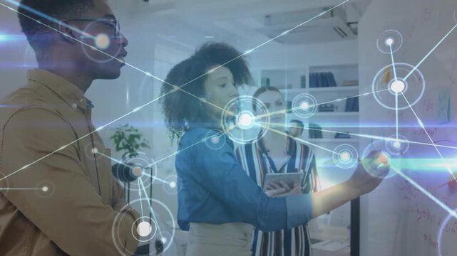 Vertical video: Central woman marking board and causing network overlay mapping ideas for business