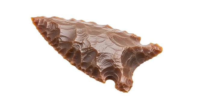 Ancient stone arrowhead closeup view.