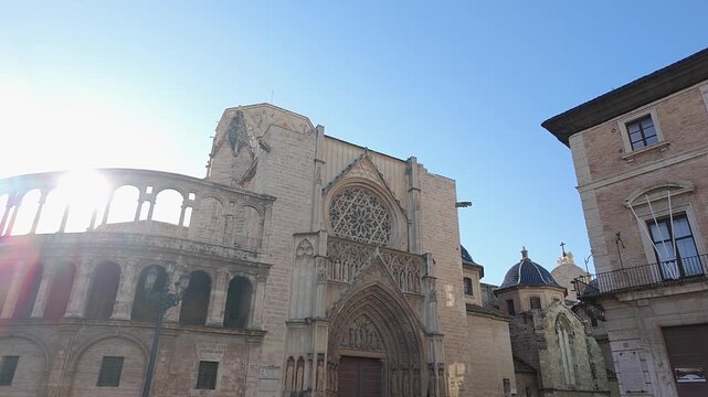 Back of the Gothic cathedral of Valencia on its facade in Plaza de la Virgen, Spain.