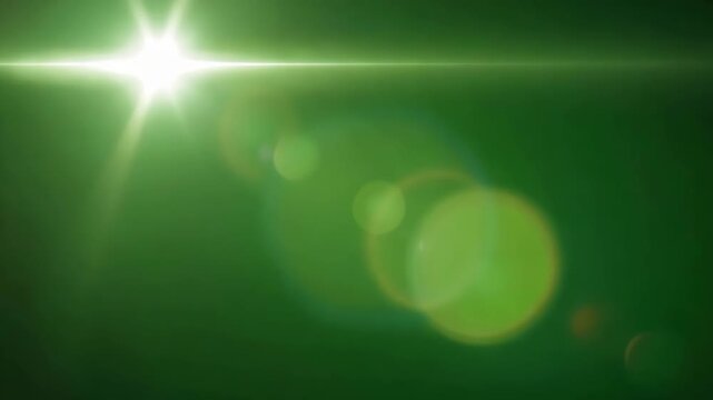 Green background with a bright light shining from the top left corner with lens flares and bokeh