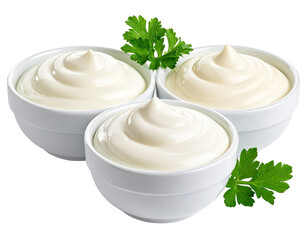 Three bowls of creamy white condiment garnished with fresh green herbs
