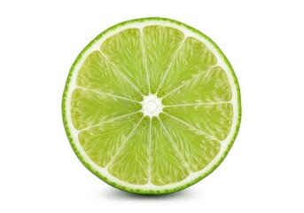 A green lime cut in half on a white background