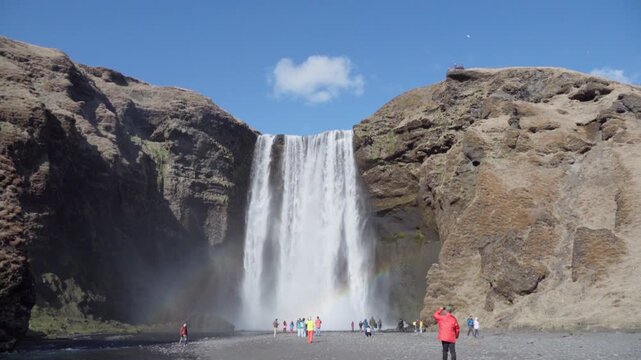 Front view of Seljalandsfoss waterfall falling from a cliff in Iceland.