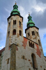 Naklejka premium Historic Stone Church Towers with Green Domes, Krakow, Poland