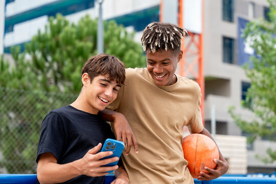 Gen-z friends sharing a fun moment outdoors