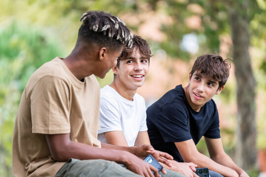 Gen-z friends enjoying playful interaction outside