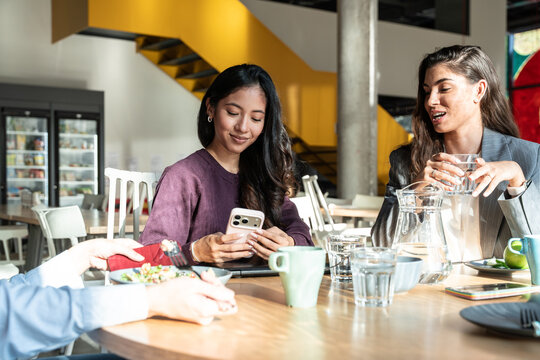 Businesswomen having casual meeting in modern office