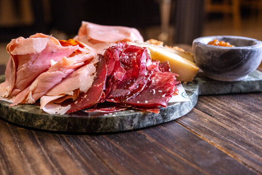 Charcuterie board with cured ham and cheese