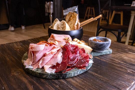 Charcuterie board with cured ham and bread