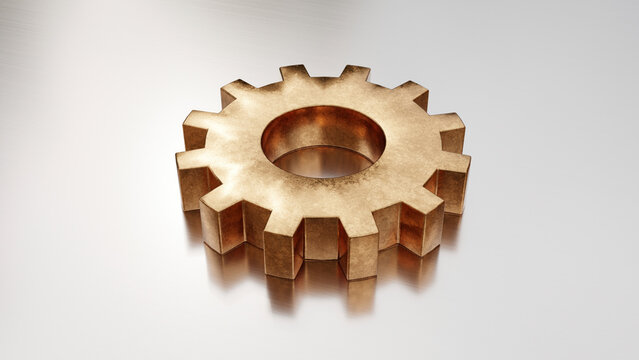 Single bronze gear isolated on reflective metal background