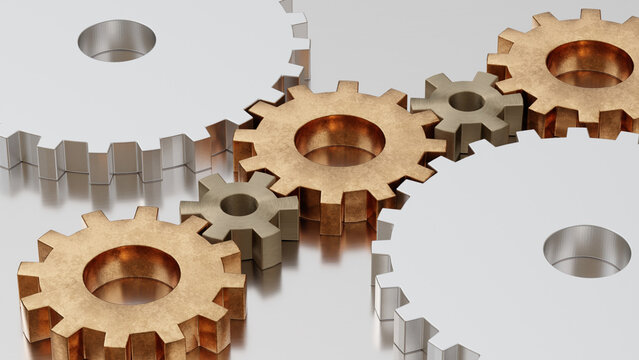 Interlocking metal gears on reflective industrial surface