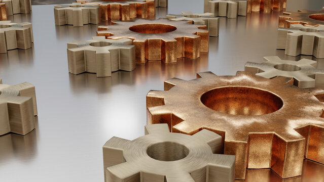 Metal gears scattered on smooth industrial steel surface