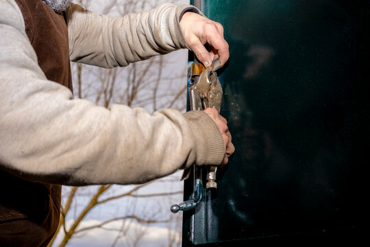 Skilled hands operating vise grips on metal surface