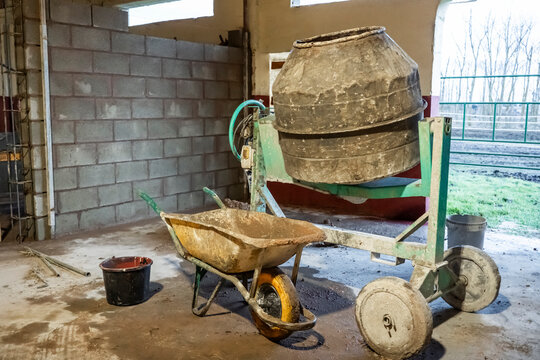 Construction site equipment with cement mixer and tools