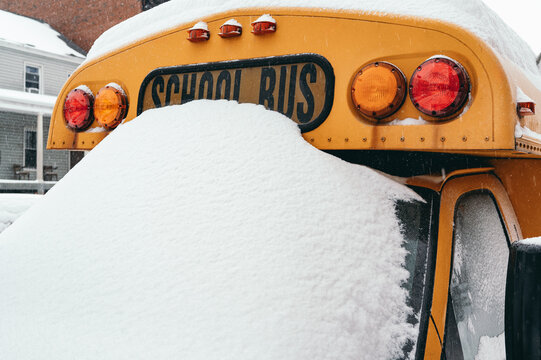 Snow-covered school bus in Brooklyn winter scene