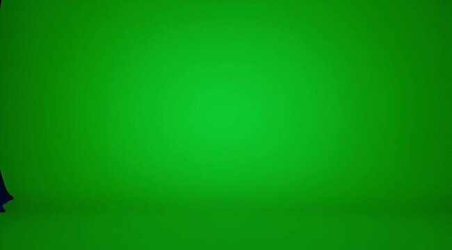 Empty vibrant green screen studio ready for creative visual effects and production.
