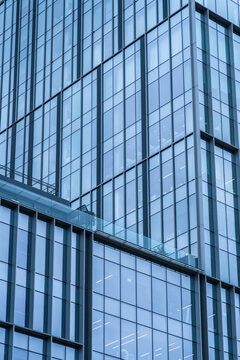 Blue glass facade of modern corporate architecture