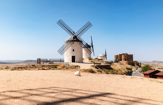 Scenic windmills of La Mancha in sunny Spanish countryside