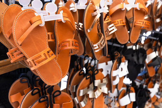 Variety of leather sandals on display in a market