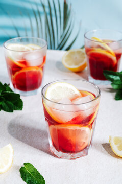 Refreshing summer red wine cocktails with citrus slices