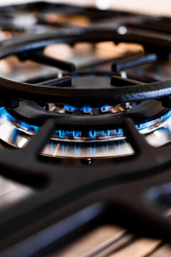 Modern kitchen stovetop with blue flame