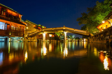 Ancient residential houses and river night view in Wuzhen water town, China