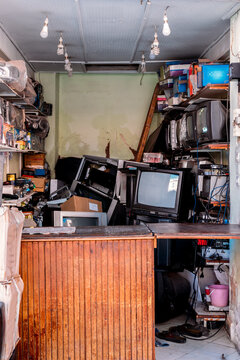 Cluttered workshop with vintage electronics and tools