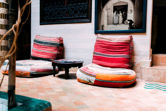 Moroccan decor in riad with traditional cushions