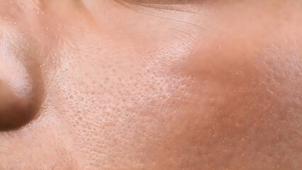 Fototapeta premium Close-up view of skin showing fine texture and subtle natural imperfections