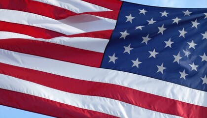 Fototapeta premium American flag waving proudly in the wind with clear blue sky