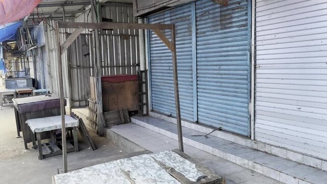Closed Market Stalls and Deserted Street