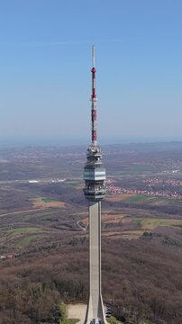 Aerial vertical pull back shot of Avala tower revealing full structure