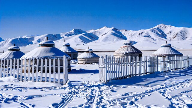 Yurts Under Snow - Capped Mountains