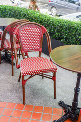 Luxury outdoor restaurant with chairs and tables near street,Loft interior,Retro classic furniture antique,Daylight from the window illuminates the whole room ,paris style restaurant.