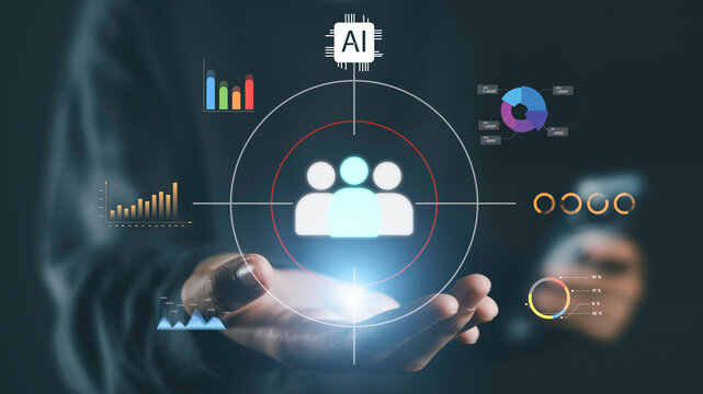AI customer targeting and audience analytics concept. Business professional holding digital customer icon with artificial intelligence chip for smart marketing segmentation and user behavior analysis.