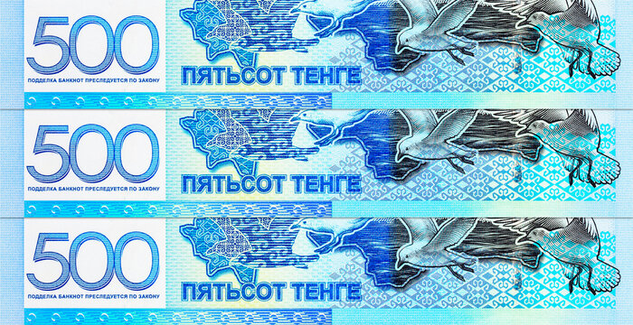 Kazakhstan 500 Tenge banknote featuring the Caspian Sea, flying gulls, and a map outline of Kazakhstan. Kazakhstan's national currency in blue tones.
