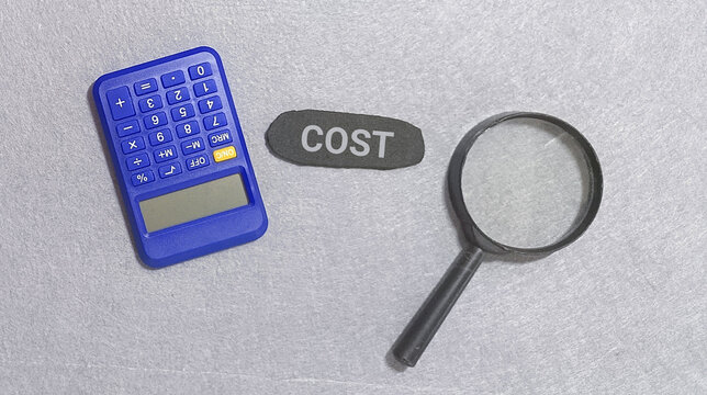 Calculator and magnifying glass with the word COST, representing financial analysis and expense management for businesses