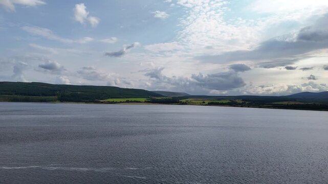 Dramatic Storm Clouds over Scottish Highlands Lake and Mountains - Aerial 4K