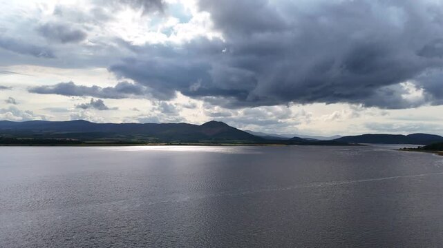 Dramatic Storm Clouds over Scottish Highlands Lake and Mountains - Aerial 4K