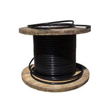 Wooden cable spool with black electrical power wire isolated on white background. Industrial cable drum for construction and telecommunications wiring.