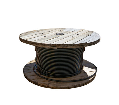 Wooden cable spool with black electrical power wire isolated on white background. Industrial cable drum for construction and telecommunications wiring.