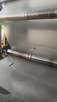 Polypropylene yarn production extruder forms polypropylene web before cutting into thread industrial line