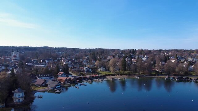 Clear Blue Water Stretches Across the Lake Under the Bright Sky With Trees Lining the Shore During a Sunny Day. Starnberg, Bavaria, Germany
