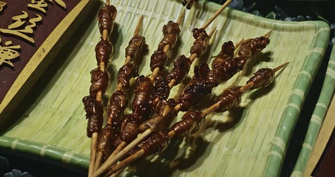 Chengdu, Sichuan, China. Insects On Sticks At Local Chinese Market. Various Cooked Insects Thread On Skewers. Crispy Insects Popular Sichuan Snack Cheap High Protein Street Food Low Fat. Cooked Bugs