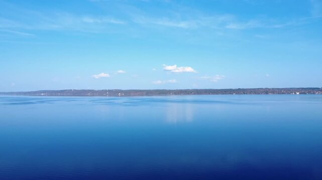 Clear Blue Water Stretches Across the Lake Under the Bright Sky With Trees Lining the Shore During a Sunny Day. Starnberg, Bavaria, Germany