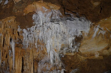 Fototapeta premium Inside of beautiful old dark cave with many stalactites. Grotte di Is Zuddas, Italy, Sardinia