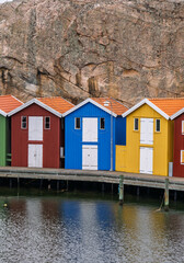 Fototapeta premium Colorful wooden fishing huts on the harbor in Smögen Sweden