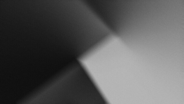 geometric planes (triangles and trapezoids) formed from the interaction between light and shadow in black and gray gradients (monochrome)