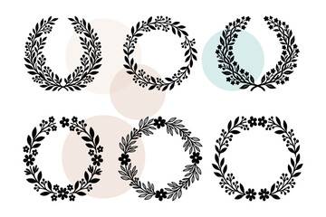 Fototapeta premium Vector set of intricate blossom borders and leafy crown symbols. Sophisticated garden wreaths for luxury stationery and feminine logo design. Ornate floral circles vector illustration